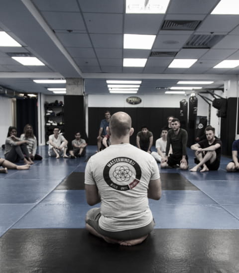 Elliott Bayev sitting infront of NoGi class at OpenMat MMA