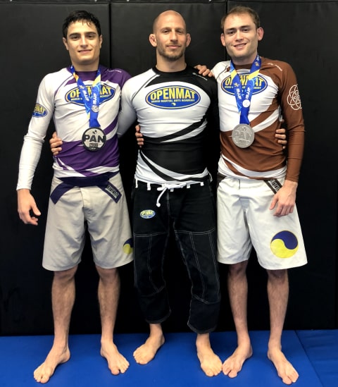 Elliott Bayev and his two black belts