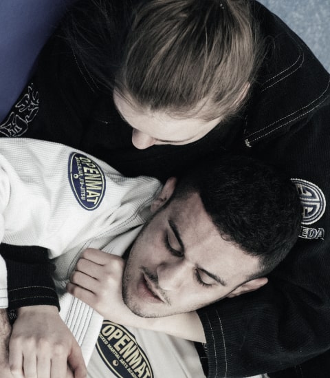 Two OpenMat MMA students rolling