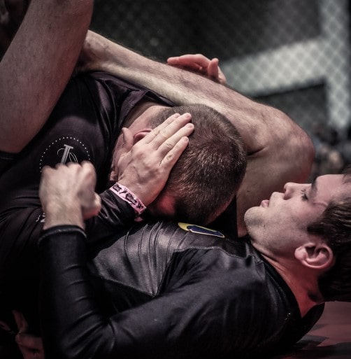 Denis rolling in grappling match